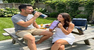 Hydration gear including insulated water bottles, soft coolers, and electrolyte mixes arranged for sports and outdoor use