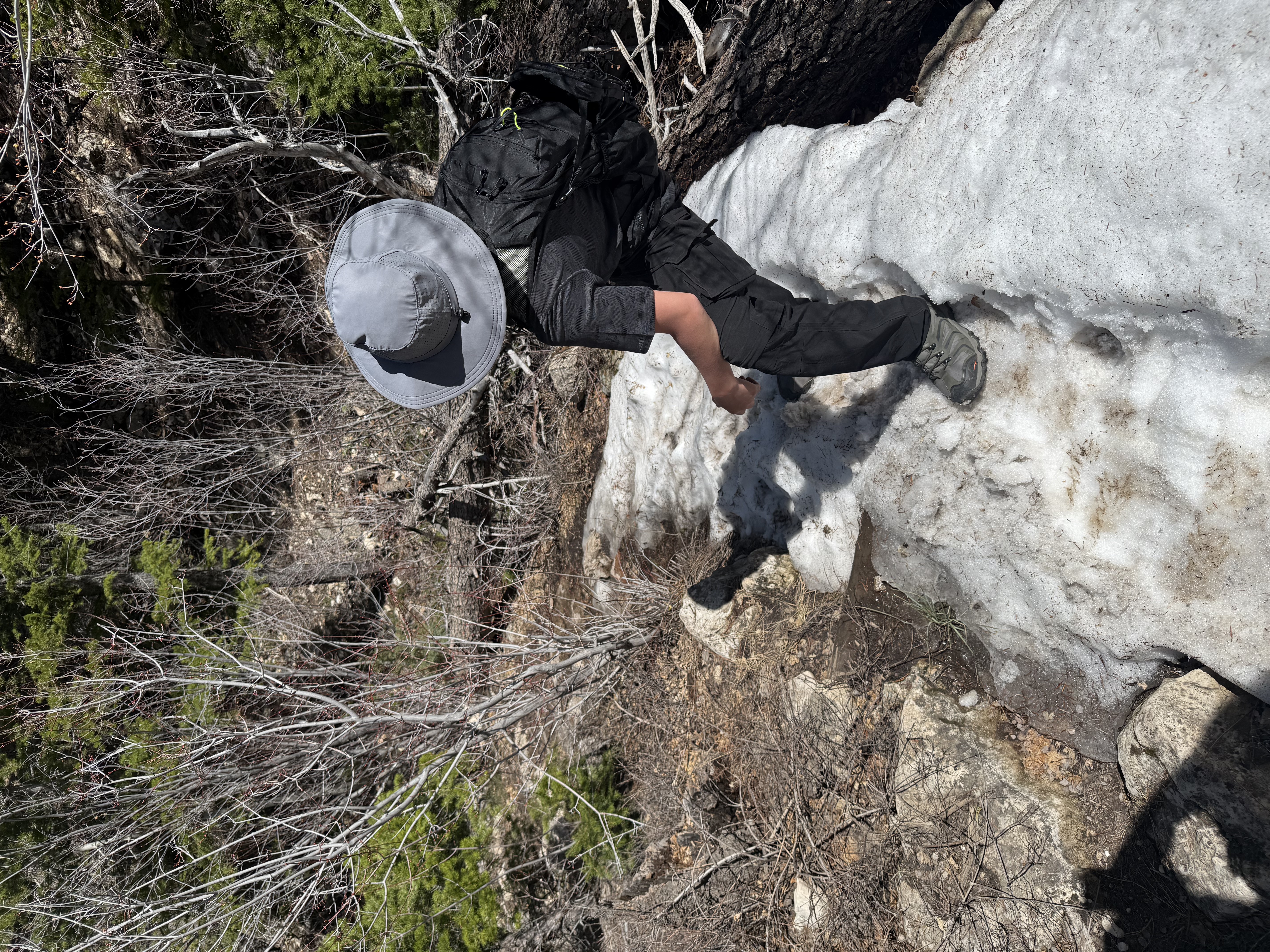 Hiking down a steep snowy trail while searching for the Beyond the Map's Edge treasure